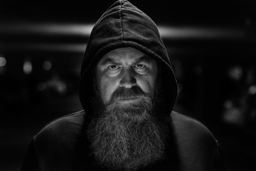 Dark shadowy portrait of a bearded man