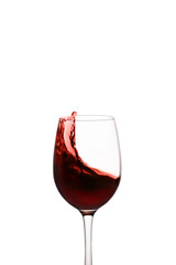splash of red wine in glass isolated on white background.