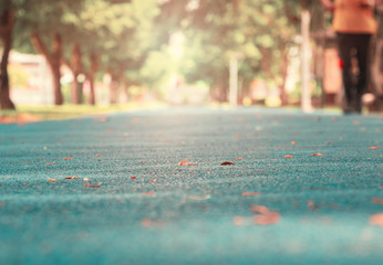 track run rubber cover blue in public park jogging exercise for health and blur people runner...