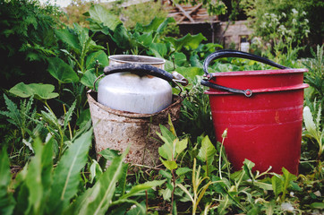 In the garden two buckets of water