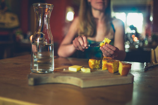 Young woman eating in restaurant