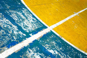 Connecting Straight and Circular White Line Merging on The Center of Grunge Field of Basketball Court. Its Can Be Used as Background or Wallpaper