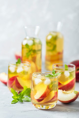 Summer cold tea with peaches and mint