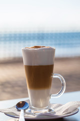 Close-up of a cappuccino in a sunrise