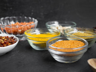 Group of bowls full of spices