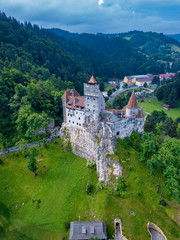 Obraz premium Aerial panorama view of the medieval Bran Castle, known for the myth of Dracula , Dracula Castle in Brasov, Transylvania. Romania.