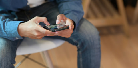 UI developer holding smartphone