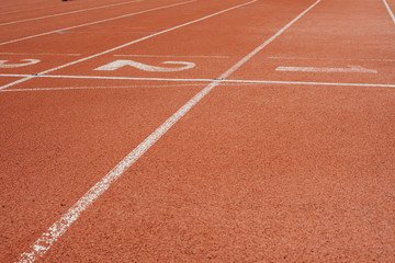 Sport. A red treadmill or athletics track at the stadium. Copy space