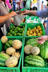 evocative image of melons, watermelons and lemons at the local market in Sicily