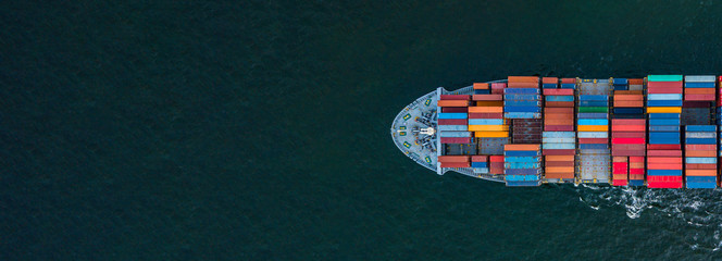 Fototapeta Container ship carrying container for import and export, business logistic and transportation by container ship boat in open sea, Aerial view container ship with copy space for design banner web obraz