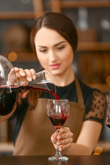 Female sommelier working in wine cellar