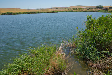 Landscape of an mountain lake in front of mountain range. Glorious lake landscape. The...