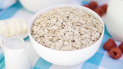 Oatmeal bowl with raspberry and milk