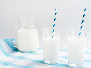 Glasses of milk with straw