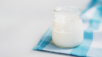 Delicious natural yogurt on a container