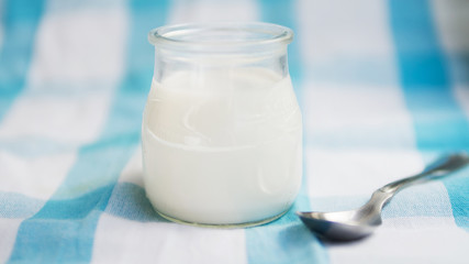 Delicious natural yogurt on a container