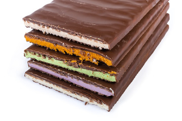 Bars of milk chocolate with varicolored filling close-up