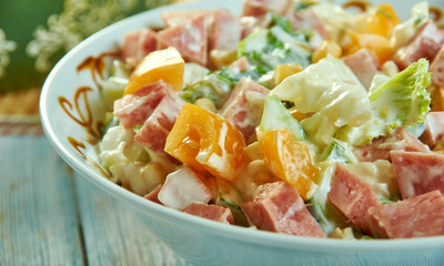 Cabbage salad with ham, cucumber and corn