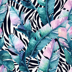 Banana leaf on animal print seamless pattern. Unusual tropical leaves, tiger stripes background