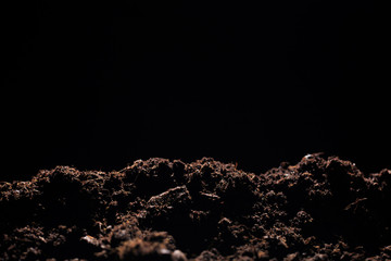  rich soil on black backgound  - Image .