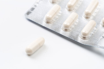 Pile of white capsules probiotic powder inside. Copy space. High resolution product. Health care concept - Image