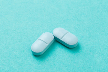 Blue tablets  on blue  background - Image .