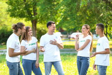 Team of volunteers outdoors on summer day