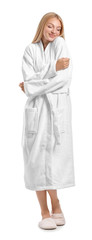 Beautiful young woman in bathrobe on white background - obrazy, fototapety, plakaty