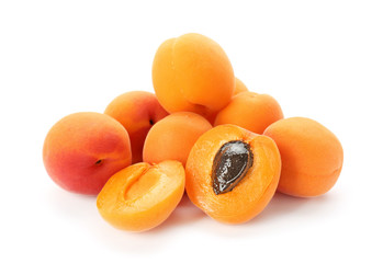 Tasty ripe apricots on white background