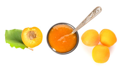Composition with tasty apricots and jam on white background