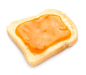 Toast with tasty apricot jam on white background
