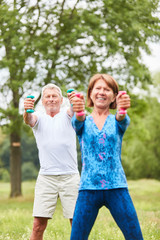 Fototapeta premium Sporty senior couple doing strength training