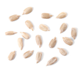 Peeled sunflower seeds on white background
