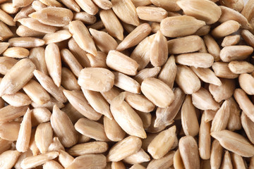 Peeled sunflower seeds as background