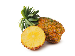 Pineapple fruit cut in half and whole fruit isolated on white background.