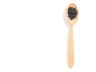 Black sesame (Sesamum) in wooden spoon on white background