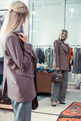 Businesswoman smiling while shopping at the weekend