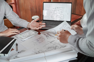 Interior architecture discussing with blueprint, Engineering Concept.