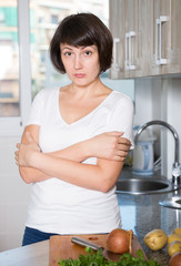 Sad woman tired of worries at kitchen
