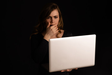 Worried woman with laptop isolated. Computer problem concept