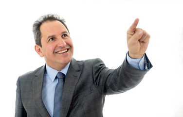 Portrait of a middle aged confident businessman pointing at copy space. Isolated on white.
