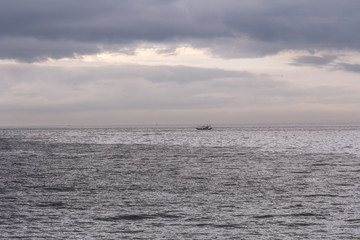 the sunlit view of the sea after the rain cloud has been lifted, jeju island korea.