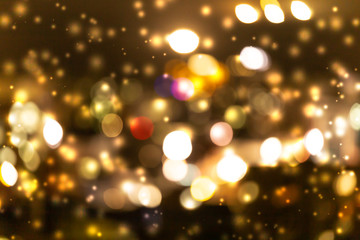 Abstract gold light bokeh background with snow