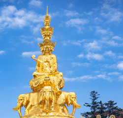 Fototapeta premium Ten-way Puxian gold statue at the top of Emei Mountain in Sichuan Province, China