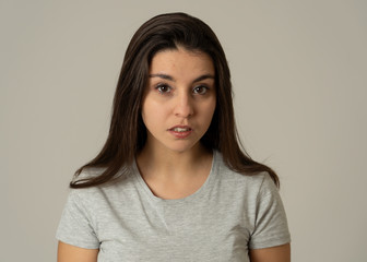 Portrait of beautiful young woman with angry and serious face. Human expressions and emotions