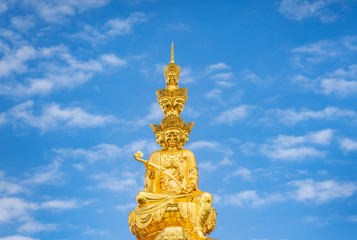 Fototapeta premium Ten-way Puxian gold statue at the top of Emei Mountain in Sichuan Province, China