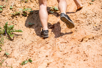 Legs of runner during obstacles course training in the boot camp