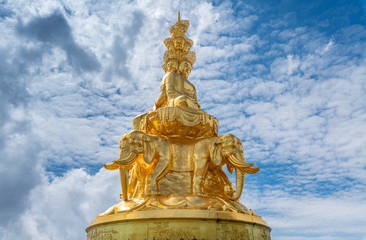 Fototapeta premium Ten-way Puxian gold statue at the top of Emei Mountain in Sichuan Province, China