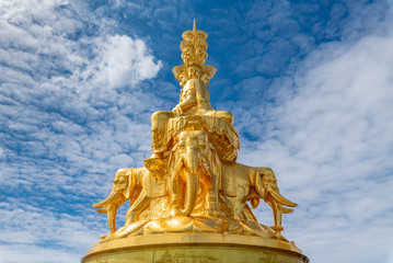 Fototapeta premium Ten-way Puxian gold statue at the top of Emei Mountain in Sichuan Province, China