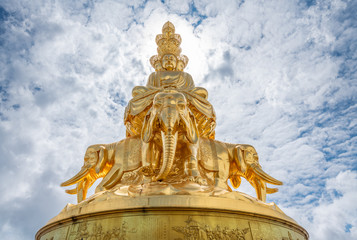 Ten-way Puxian gold statue at the top of Emei Mountain in Sichuan Province, China